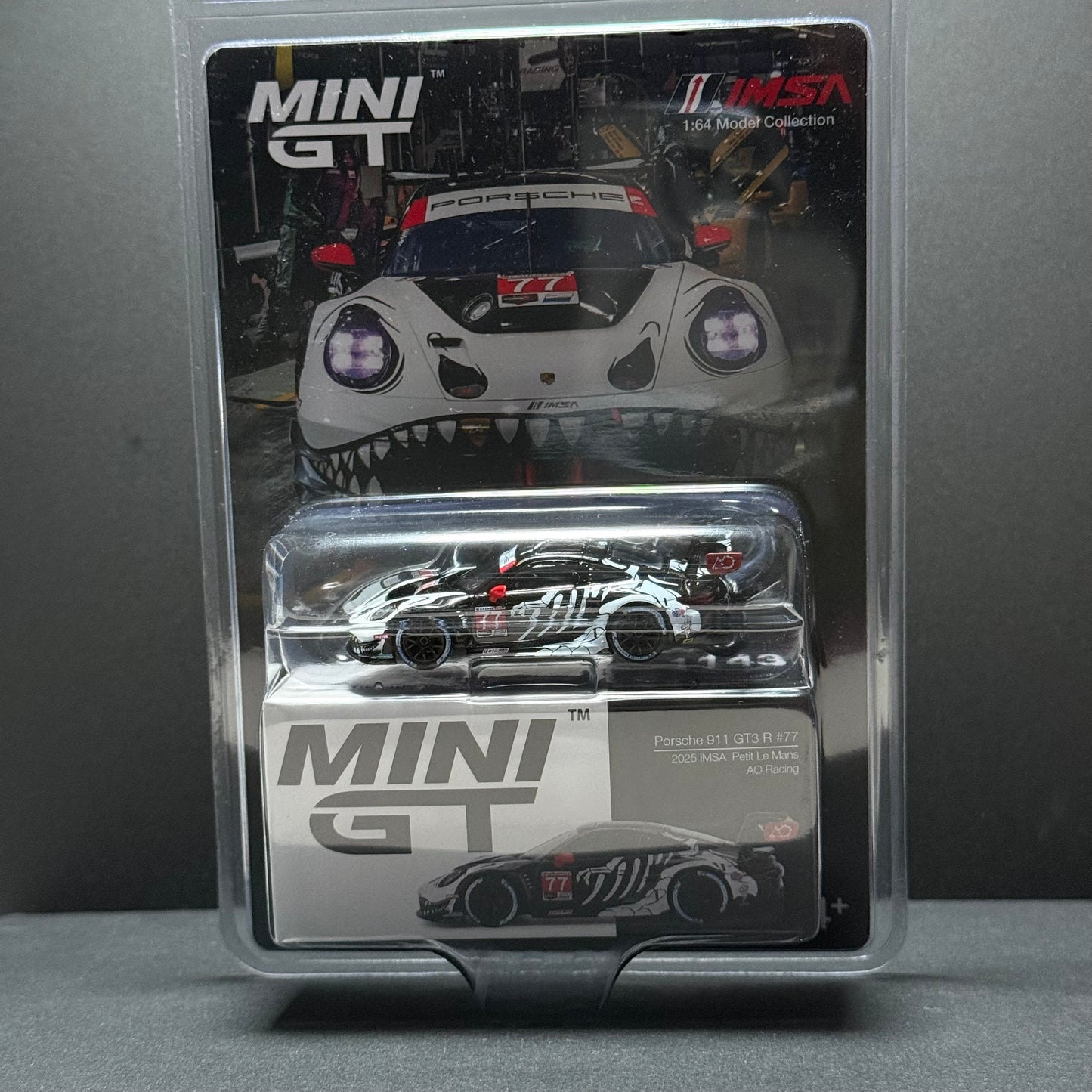 MINI GT Porsche 911 GT3 R #77 AO Racing (Skeleton Rexy) 1:64